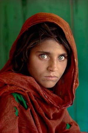 Sharbat Gula, Afghan Girl, at Nasir Bagh refugee camp near Peshawar, Pakistan, 1984 by Steve McCurry.